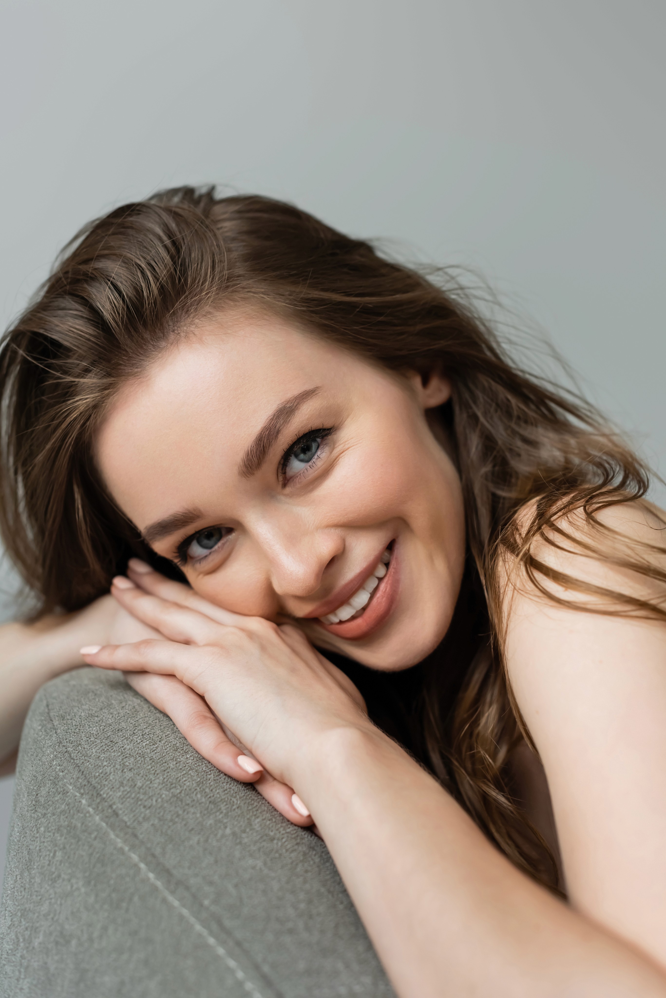 Woman with natural makeup showcasing radiant skin